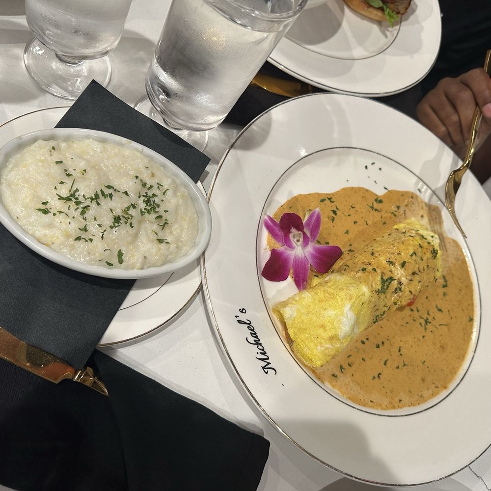 Seafood omelette with a side of grits Seafood omelette with a side of grits