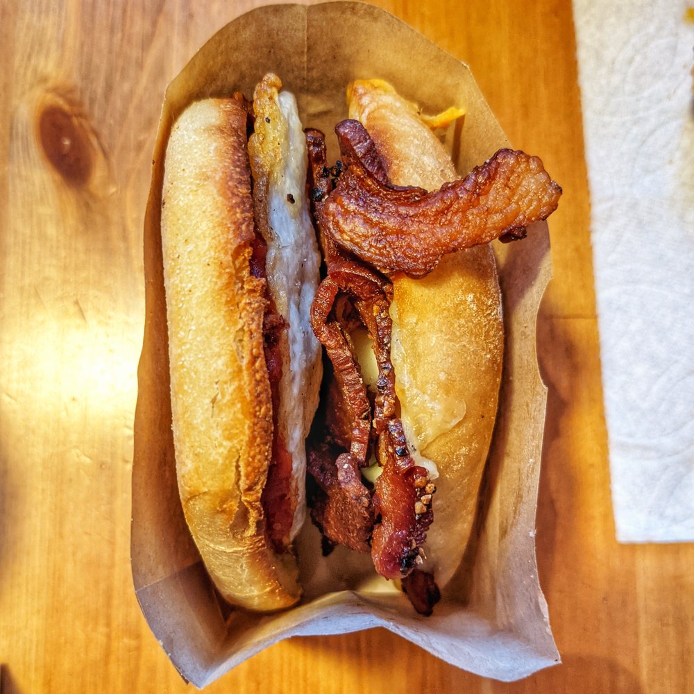Sunny Up - Ruth Bacon Ginsburg: pepper bacon, egg, white cheddar, tomato jam, thyme aioli - Food Trucks Near Me Sunny Up - Ruth Bacon Ginsburg: pepper bacon, egg, white cheddar, tomato jam, thyme aioli - Food Trucks Near Me