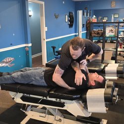 Marsh Chiropractic and Wellness Center - Dr. Tyler giving a patient a chiropractic adjustment