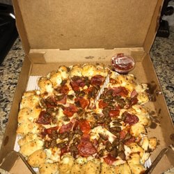 Pizza Hut - This is a large meat lovers pizza (pepperoni, ham, sausage) with cheesy bite crust. Crust looks sloppy but I hope it tastes good.