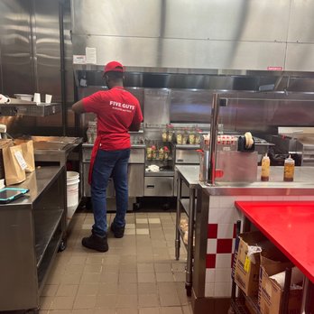 Five Guys - a man in a restaurant kitchen - Burgers Near Me - North Charleston, South Carolina Five Guys - a man in a restaurant kitchen - Burgers Near Me - North Charleston, South Carolina