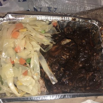 Peppa's Jerk Chicken - Large oxtails, cabbage and rice and peas underneath. Very yummy. 2 giant oxtails and then lots of smaller ones - Caribbean Near Me - Brooklyn, New York
