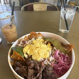 Red chilaquiles with carne asada Red chilaquiles with carne asada
