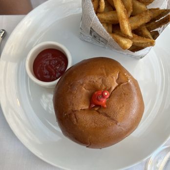 Artisan - smash burger topped with the cutest tomatoes - New American Near Me - Traverse City, Michigan