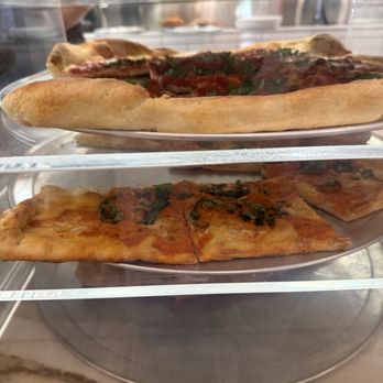 Santoro's Italian Kitchen - Display case of different sold by the slice offerings - Italian Near Me - Greensboro, Georgia