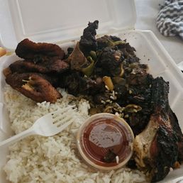 Oxtail combo jerk chicken with plantain and rice Oxtail combo jerk chicken with plantain and rice