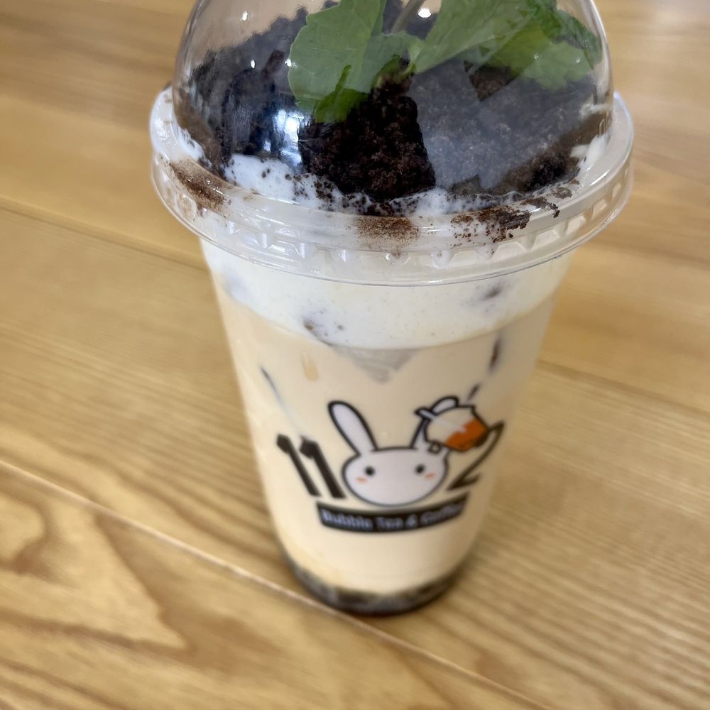 Organic Jasmine Milk Tea with boba, sea salt topping, crushed Oreos, and a garnish of fresh mint. You can customize sweetness.