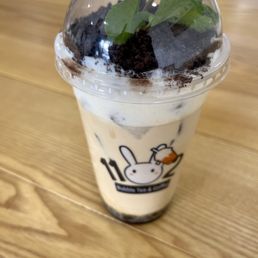 Organic Jasmine Milk Tea with boba, sea salt topping, crushed Oreos, and a garnish of fresh mint. You can customize sweetness.