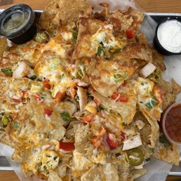 Nachos with chicken. Came with salsa, sour cream and guacamole Nachos with chicken. Came with salsa, sour cream and guacamole