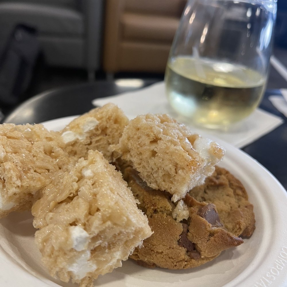 Admirals Club PHX - Some delicioussss marshmallow squares, cookies and Chardonnay - Airport Lounges Near Me - Phoenix, Arizona