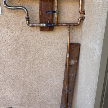 Lucky Rooter & Plumbing - outside 3 valve loop. Softener will be installed where the steel flex pipe is. - Plumbing Near Me