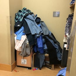 Pile of clothes in the dressing room at least 6 ft high.