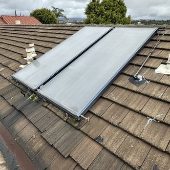 RoofTek & Waterproofing Systems - Before with the solar heating panels that had to be moved. - Roofing Near Me - Orange, California
