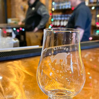 Fainting Goat Spirits - a glass on a bar - Distilleries Near Me - Greensboro, North Carolina