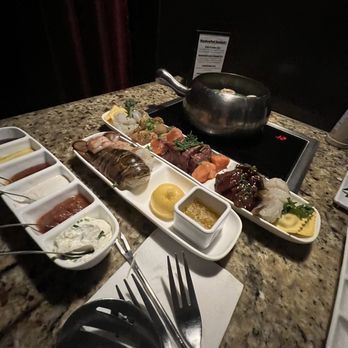 The Melting Pot - a variety of food on a table - Fondue Near Me - Palm Beach Gardens, Florida