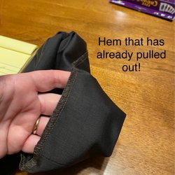 Jenny's Alterations - The hem that has already pulled out when I barely pulled the seam up to see how close the stitches were.