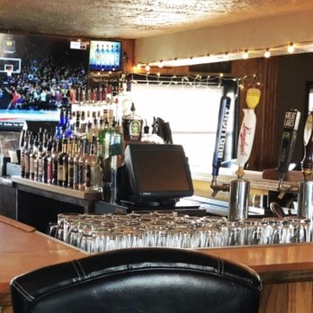 Jose's Landing - a bar with a lot of glasses on the bar - Dive Bars Near Me - Canton, Ohio