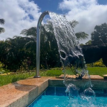 Puni Nani Pools & Spa - Water feature with the water fall attachment. (dog not included) - Pool & Hot Tub Service Near Me - Lihue, Hawaii Puni Nani Pools & Spa - Water feature with the water fall attachment. (dog not included) - Pool & Hot Tub Service Near Me - Lihue, Hawaii