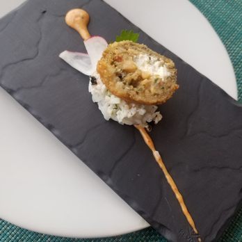 Aleta - Complementary Amuse bouche. Croquet on top of a sushi style rice with crab pieces in it. - Seafood Near Me - Cabo San Lucas, BCS Aleta - Complementary Amuse bouche. Croquet on top of a sushi style rice with crab pieces in it. - Seafood Near Me - Cabo San Lucas, BCS
