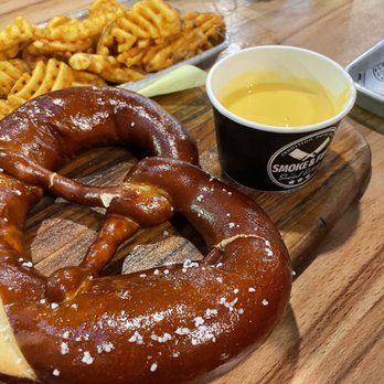 Smoke & Fire Social Eatery - Bavarian pretzel with cheese and waffle fries - so good! - Comfort Food Near Me - Paramount, California Smoke & Fire Social Eatery - Bavarian pretzel with cheese and waffle fries - so good! - Comfort Food Near Me - Paramount, California