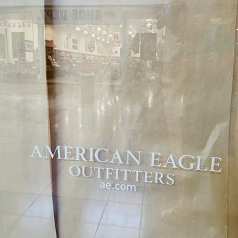 Macy's - A glass storefront window displays the American Eagle Outfitters logo and website, with a mall interior visible through the glass. - Department Stores Near Me - Youngstown, Ohio