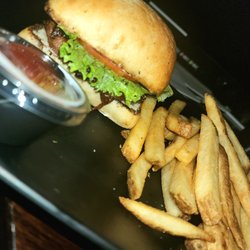 Alamo Drafthouse Cinema Staten Island - One of the food options that you get at your table I choose a burger with lettuce and tomato and onions with fries.