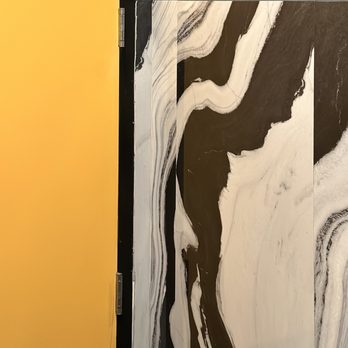 The Magpie - Loved the yellow of the bathroom door next to the marble looking wainscoting. - New American Near Me - San Antonio, Texas The Magpie - Loved the yellow of the bathroom door next to the marble looking wainscoting. - New American Near Me - San Antonio, Texas