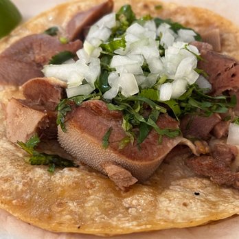Taqueria La Placita -2 - a taco with meat, onions, and cilantro - Mexican Near Me - Chicago, Illinois Taqueria La Placita -2 - a taco with meat, onions, and cilantro - Mexican Near Me - Chicago, Illinois