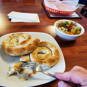O Blaxos - Filloswirl, like spanokopita, cheese and spinach filled with a side of Greek toursi, pickled veggies. - Greek Near Me - Wayne, New Jersey