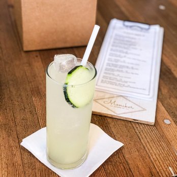 Moniker Cocktail Co - a glass of cucumber and a paper straw - Cocktail Bars Near Me - San Diego, California Moniker Cocktail Co - a glass of cucumber and a paper straw - Cocktail Bars Near Me - San Diego, California