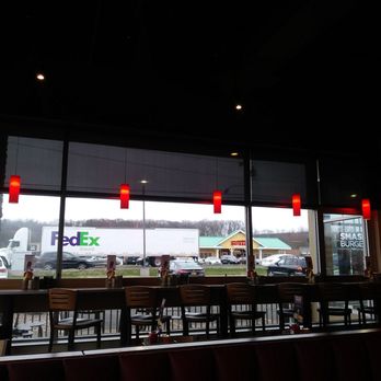 Smashburger - Modern decor inside. They have stools or you can sit at a table. All about preference. - Burgers Near Me - Southington, Connecticut