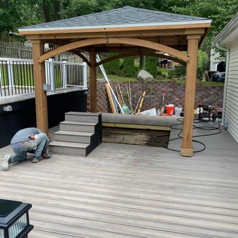 NST Services - a man working on a deck - General Contractors Near Me NST Services - a man working on a deck - General Contractors Near Me