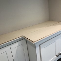 UNG Handyman Services - Cabinets top cap with 1/2 plywood after installing supports to raise up and flush mount with crown molding