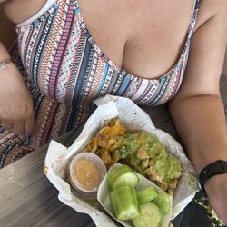 Filiberto’s Mexican Food - Half eaten cowboy fries with cucumbers