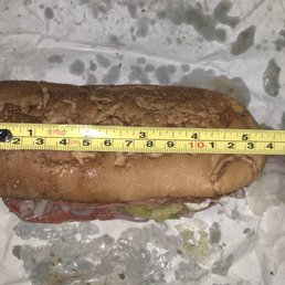a sandwich with a measuring tape on it a sandwich with a measuring tape on it