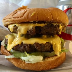 Marie's Old Fashioned Hamburgers - HUMONGOUS! The large double is about 4" tall. It's a delicious mayo, onions, shredded lettuce and pickles version: $6.75.