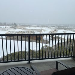 Tetherow - The balcony with a view of the snowy landscape.