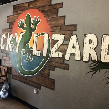 Lucky Lizard Tap House - a sign for lucky lizard - Beer Bar Near Me - Madeira Beach, Florida