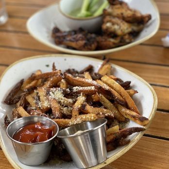 Monkeypod Kitchen - Garlic Truffle Oil Fries & Wood - Roasted Free Range Chicken Wings - Hawaiian Near Me - Kapolei, Hawaii Monkeypod Kitchen - Garlic Truffle Oil Fries & Wood - Roasted Free Range Chicken Wings - Hawaiian Near Me - Kapolei, Hawaii