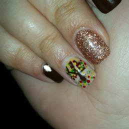 These are my thanksgiving nails.she hand painted the gold diamond and the tree! These are my thanksgiving nails.she hand painted the gold diamond and the tree!