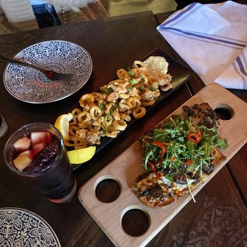 Cafe Sevilla - Calamares Fritos ($9) Baked Manchego Cheese and Chorizo Empanda Duo ($9) Mushroom & Fig Coca ($9) Large Seafood Paella Mariners (Full $59) - Spanish Near Me - Costa Mesa, California