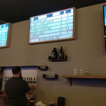 Deviant Wolfe Brewing - Menu behind bar. - Breweries Near Me - Sanford, Florida