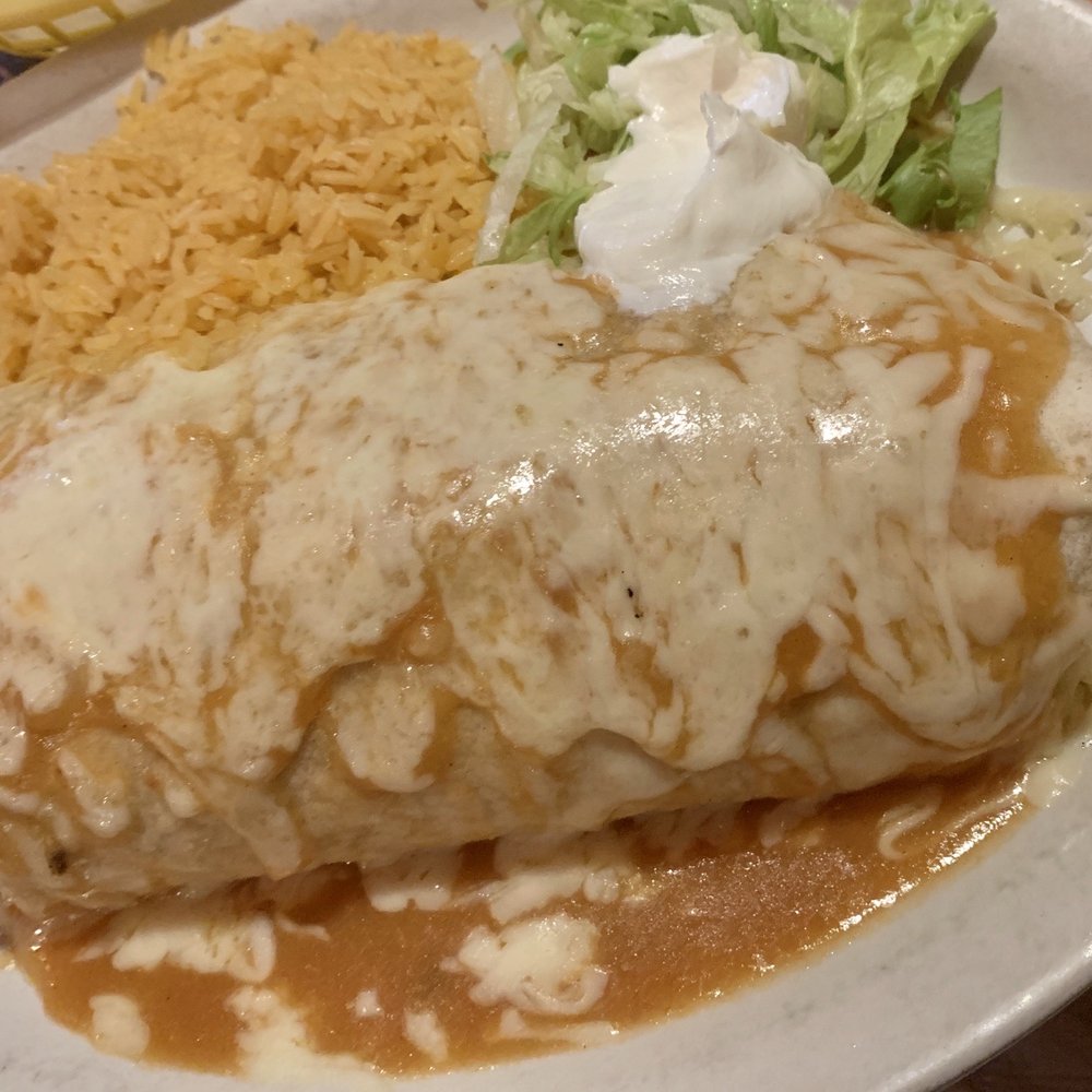 Fajita burrito with steak and chicken. Fajita burrito with steak and chicken.