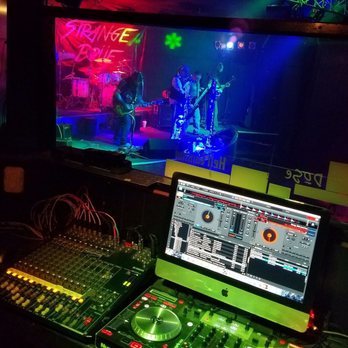 Elixir Nightclub - a dj's desk with two monitors and a laptop - Dive Bars Near Me - Cabot, Arkansas