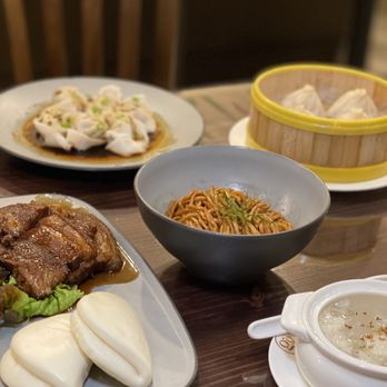 Shanghai Villa - a variety of chinese dishes on a table - Shanghainese Near Me - New York, New York Shanghai Villa - a variety of chinese dishes on a table - Shanghainese Near Me - New York, New York