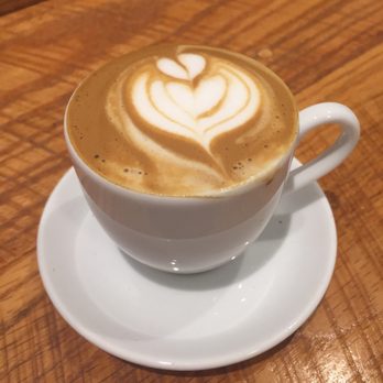 Lone Light Coffee - a cup of coffee on a saucer - Coffee & Tea Near Me - Charlottesville, Virginia