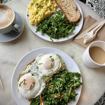 Cafe de Miro - Avocado Toast with 2 eggs and a regular coffee. Feta Omelette in the back with 12 oz. Vanilla Latte. - Mediterranean Near Me - Grand Rapids, Michigan Cafe de Miro - Avocado Toast with 2 eggs and a regular coffee. Feta Omelette in the back with 12 oz. Vanilla Latte. - Mediterranean Near Me - Grand Rapids, Michigan