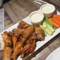 Wings half lemon pepper half honey Sriracha
