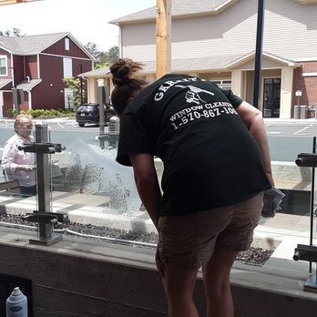 Garrity's window cleaning - cleaning fire pit glass - Window Washing Near Me Garrity's window cleaning - cleaning fire pit glass - Window Washing Near Me
