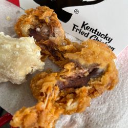 KFC - Chicken wings consist of a bloody bone and breaded skin. Very low quality prices as high as at sit down restaurants.